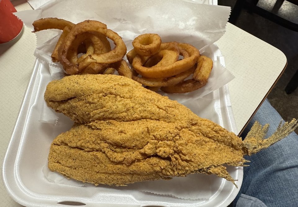 Fried fish plates on a restaurant table.