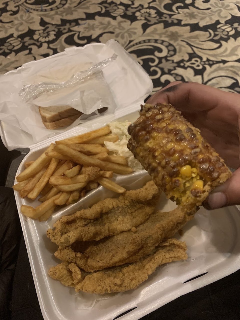 Printed menu with catfish and wings.
