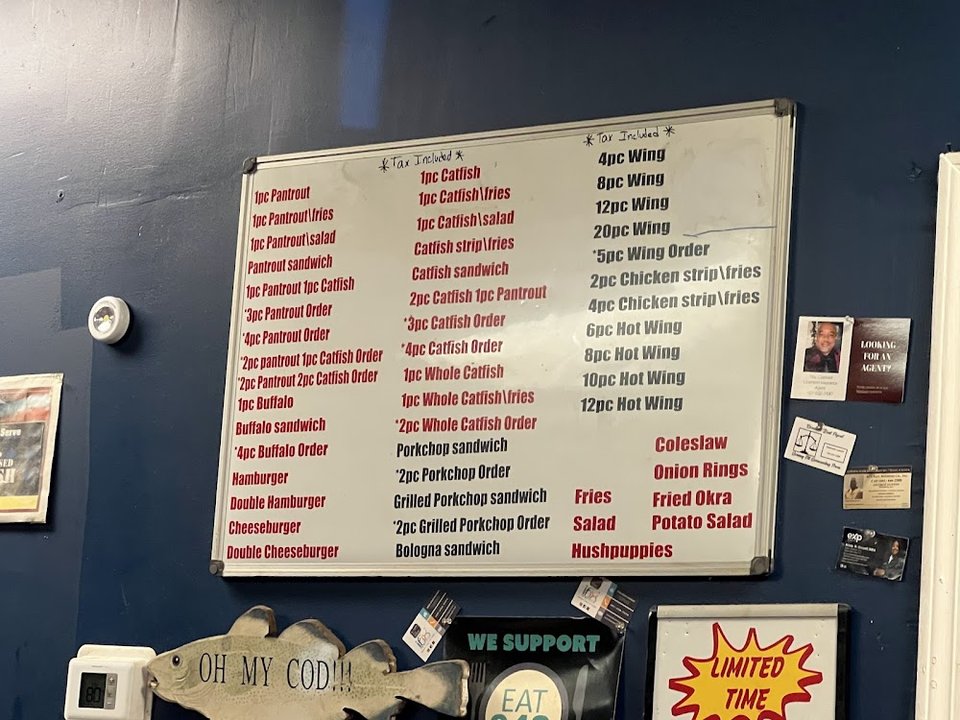 Menu board with fried fish options.